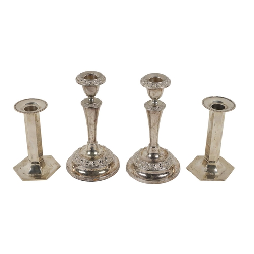 40 - A pair of attractive Sterling silver monogrammed hexagonal shaped Bachelor Candlesticks, with remova... 