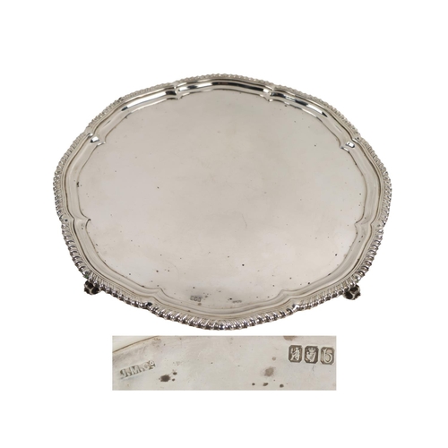54 - A fine quality Irish Georgian style large silver Salver, with shaped gadroon edge, plain center on s... 