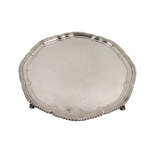 54 - A fine quality Irish Georgian style large silver Salver, with shaped gadroon edge, plain center on s... 