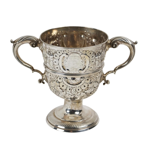 142 - A fine quality Irish silver 19th Century two handled Trophy Cup, the overall of repoussé design with... 