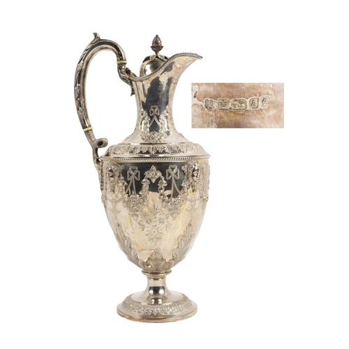 123 - A fine quality Victorian Adams design silver Claret Jug, with overall etched and relief design with ... 
