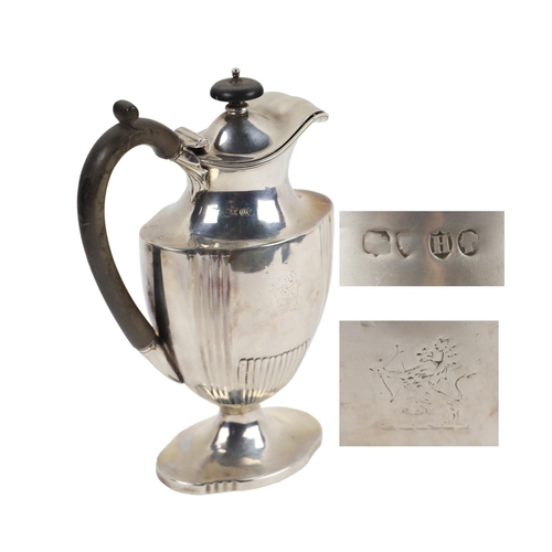 125 - An attractive Victorian Coffee Pot, of ewer design with ebonised finial on hinged lid, with wooden h... 