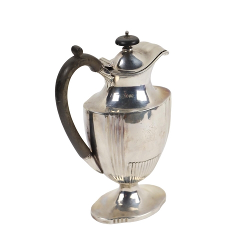 125 - An attractive Victorian Coffee Pot, of ewer design with ebonised finial on hinged lid, with wooden h... 