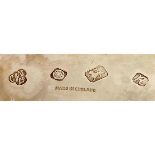 128 - A pair of large Georgian style silver Sauceboats, with gadroon edge, scroll handle, on shell capped ... 