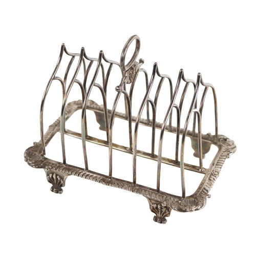 130 - A fine quality early 19th Century Gothic design Toast Rack, with gadroon border and shell decoration... 