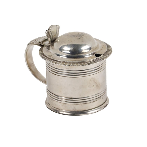 133 - A quality Irish Georgian silver tankard design Mustard Pot, with blue glass liner, the hinged top wi... 