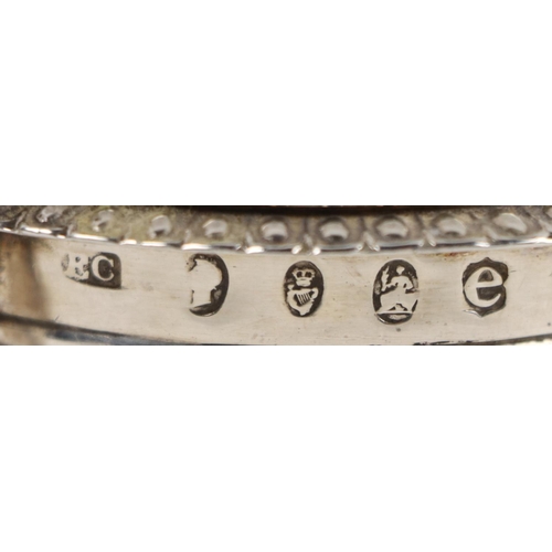 133 - A quality Irish Georgian silver tankard design Mustard Pot, with blue glass liner, the hinged top wi... 