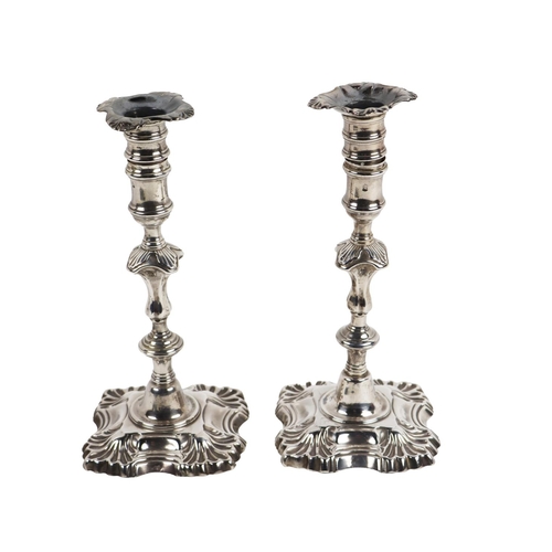 141 - A quality pair of Irish silver George II period Candlesticks, each with detachable sconces with scal... 