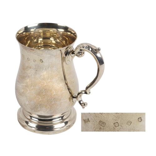 146 - A large Medieval style silver Tankard, with scroll handle, bulbous body on circular base, approx. 17... 