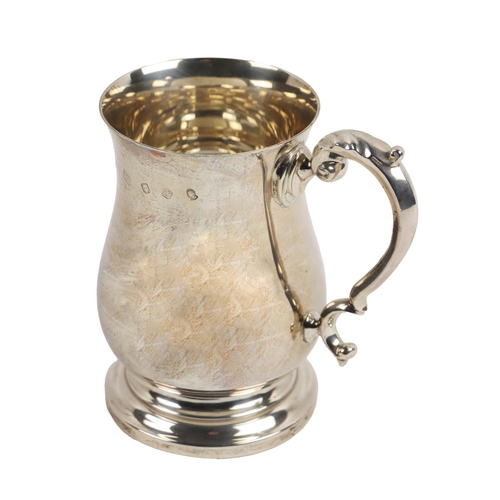 146 - A large Medieval style silver Tankard, with scroll handle, bulbous body on circular base, approx. 17... 