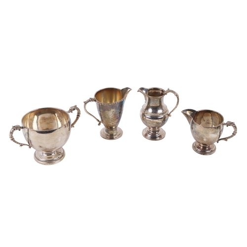 147 - A group of four Celtic Revival silver Pieces, including two handled Bowl, and three varied Cream Jug... 