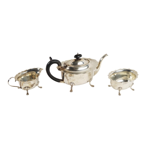 151 - A three piece Edwardian silver Tea Service, comprising teapot, cream jug and sugar bowl, each with s... 
