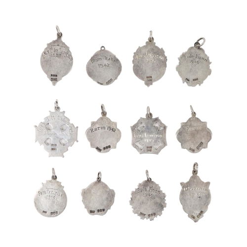176 - Medal: [Co. Laois, G.A.A.] a group of 12 silver Presentation Medals of variant designs (with typical... 