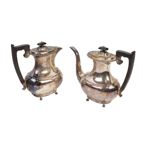 154 - An English silver Teapot and matching Hot Water Pot, each with hinged lid and ebonised finials with ... 