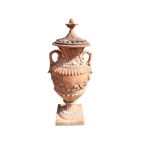 21 - An impressive pair of terracotta coloured composition stone Garden Urns, each relief moulded with sc... 