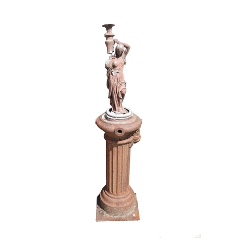 42 - A Victorian period 'Street' Pump, with pewter figure surmounted, depicted carrying water, on reeded ... 