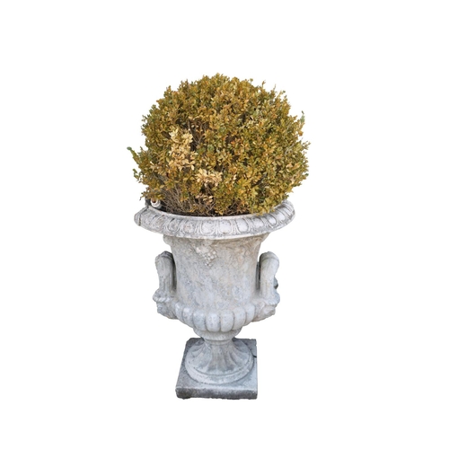 59 - A pair of large classical design sandstone Urns, with egg n' dart moulded edges, vine leaf design in... 