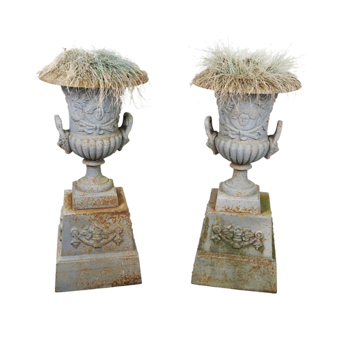 6 - A pair of Victorian style painted two handled cast iron Garden Urns on stands, approx. 94cms high (3... 