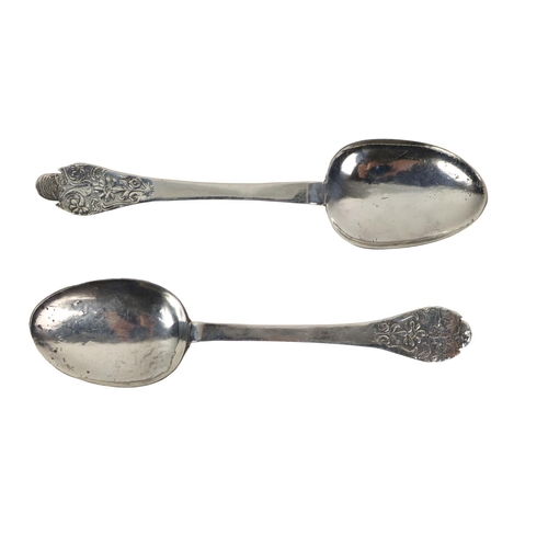 12 - A rare pair of late 17th Century English silver Trifid Spoons, of floral repoussé form, each engrave... 