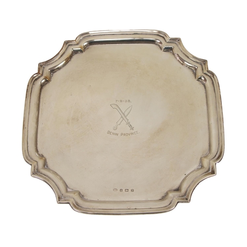 37 - A heavy English silver Tray, with moulded shaped edge, inscribed '7.9.38,' Benin Province, with cros... 