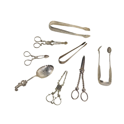 4 - Silverware: A fine quality large Irish Georgian period floral decorated repouss&eacute; Sugar Tongs,... 