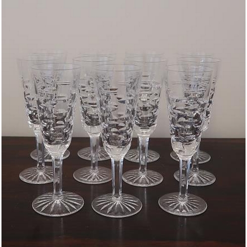 31 - A set of eleven Waterford crystal Tralee pattern champagne glasses.