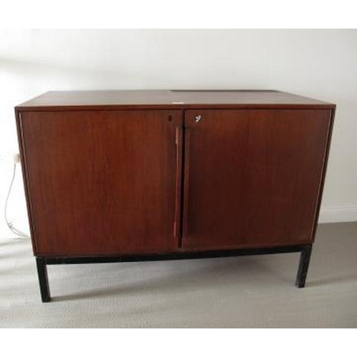 40 - A mid 20th century coctail cabinet raised on metal supports, cms long, 113 cms long.