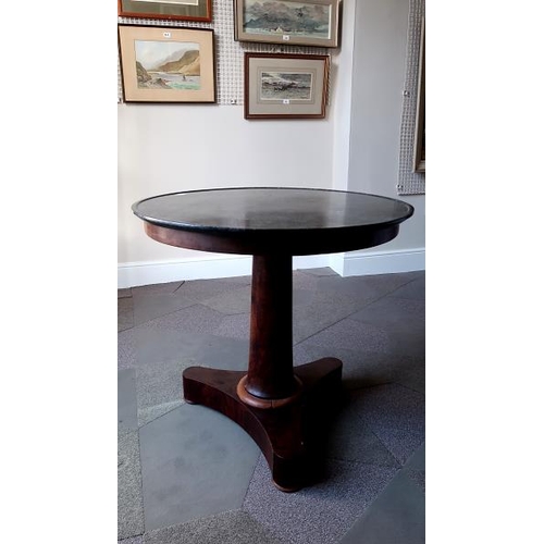46 - A William IV circular mahogany occasional table, with grey slate circular top, 77 cms high, 82 cms d... 