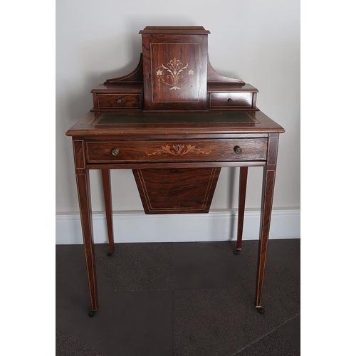 49 - An Edwardian rosewood work table with superstructure above frieze drawer, and drawer below on square... 