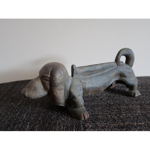 58 - A Victorian cast iron foot scraper modelled as a dash hound, 38 cms long, 16 cms high.
