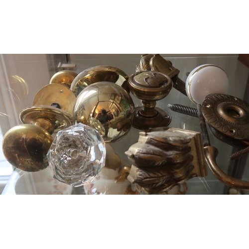 9 - A collection of Victorian brassware, two Victorian door handles etc.