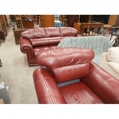 511 - Red leather three seater sofa and matching armchair