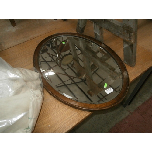 152 - Oak framed bevel edged oval mirror