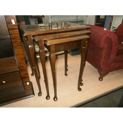 157 - Nest of glass topped walnut tables