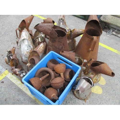 1046 - Large selection of tin oil jugs and funnels