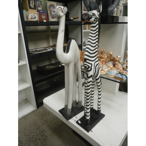 385 - Wooden Zebra and camel figurines