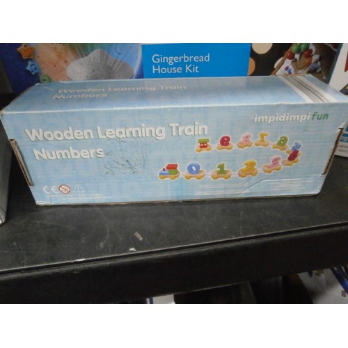 45 - Eight boxed items inc musical star projector, Fingerprint kit, Wooden learning train, etc