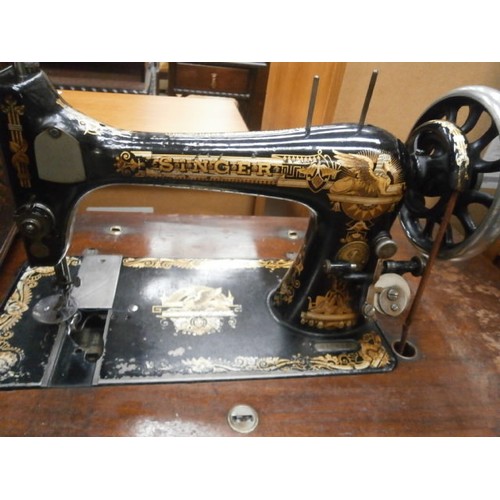 715 - Vintage SINGER sewing machine in cast treadle stand