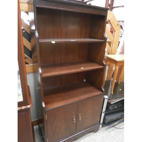 616 - Mahogany waterfall bookcase on cupboards