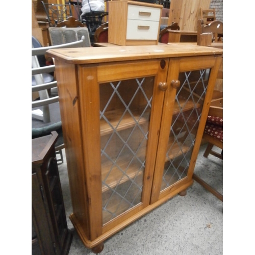 660 - Small glazed pine cabinet