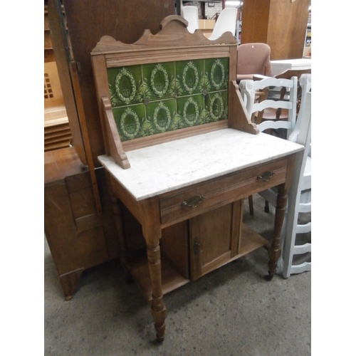 667 - Small marble topped washstand with drawer and tiled upstand - one broken tile