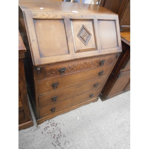 671 - Vintage 4 drawer carved oak bureau