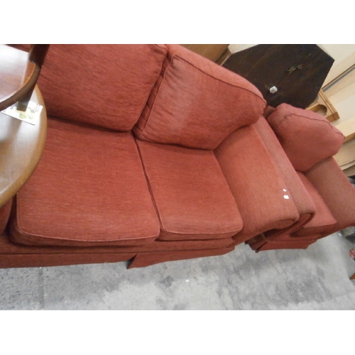 716 - Large upholstered settee and a similar armchair