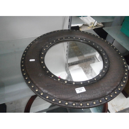 374 - Decorative leather framed circular mirror