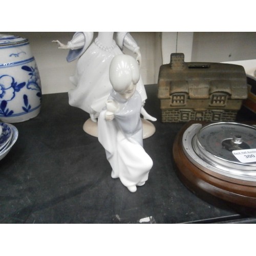 300 - Lot inc horseshoe barometer, Stoneware money box, Two Nao Lladro figurines, one has some finger dama... 