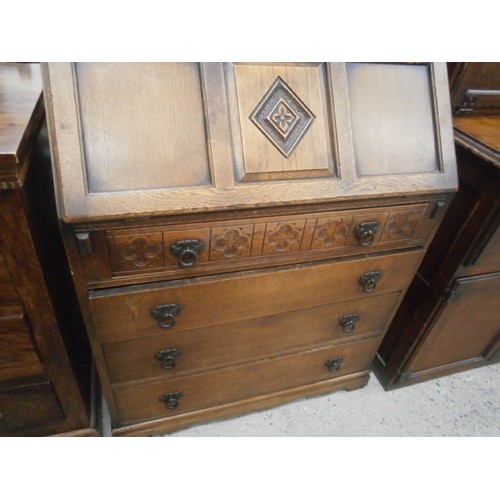 671 - Vintage 4 drawer carved oak bureau