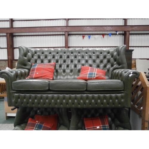 611 - Green buttoned leather wing back settee