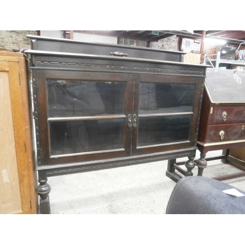 686 - Vintage ebonised 2 door glazed cabinet