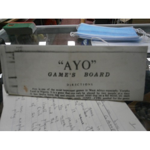 232 - Old  Ayo games board with seeds and instructions of play