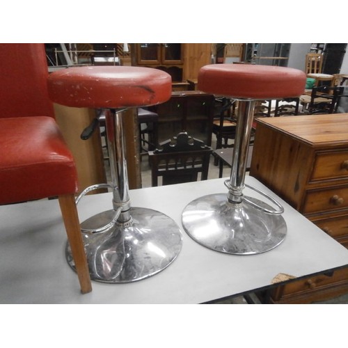 633 - Pair of red faux leather dining chairs and a pair of chrome based bar stools